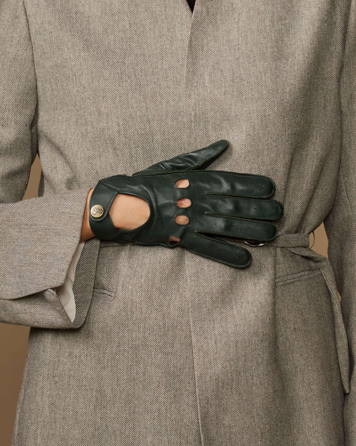 Dark green leather gloves with buttoned finger cutouts and slim wrist tabs