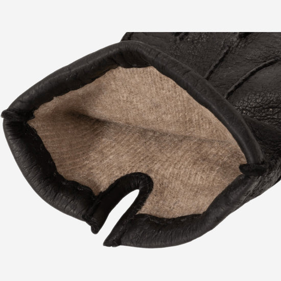 Dark leather glove open cuff showing soft beige cashmere lining