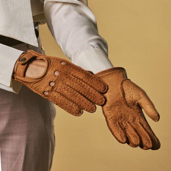 Cognac peccary leather driving glove with perforated knuckles and side panel stitching