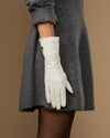 White long leather gloves, full hand view with subtle logo on cuff