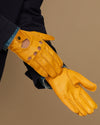 Men's yellow lambskin glove on wrist, stitched finger panels and buttoned cuff
