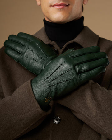 Men's dark green leather gloves with stitched details, wool-lined cuffs