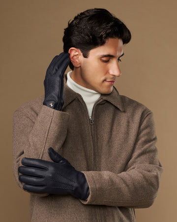 Men's navy goatskin leather gloves with wool lining, stitched finger and palm design