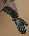 Dark green Jake sheepskin gloves with warm fleece lining, side view on sleeve cuff