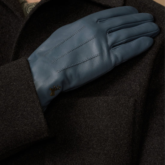 Blue sheepskin gloves with stitched back panel and small emblem