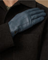 Blue sheepskin gloves with stitched back panel and small emblem