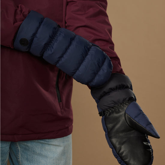 Pair of blue insulated mittens with textured cuff and dark touchscreen thumb panel