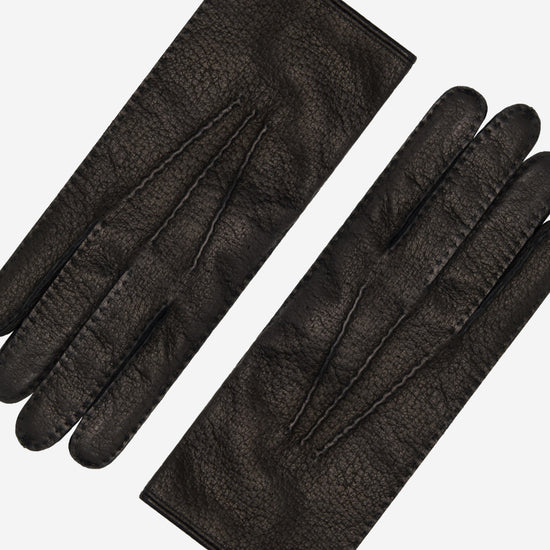 Pair of women's black leather gloves showing palm and back views