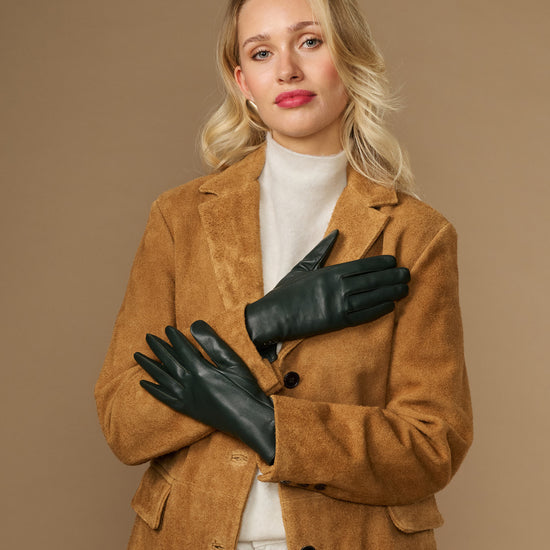 Dark green leather gloves with silk lining, touchscreen tips, and snug fitted cuffs