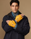 Yellow fingerless driving gloves held together, perforated knuckle details