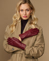 Bordeaux leather gloves with fleece-lined cuffs and stitched detailing across fingers