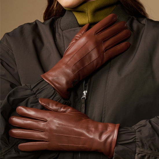 Cognac brown leather gloves, long cuffs, fitted fingers with warm fleece lining