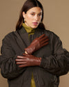 Cognac brown leather gloves with warm fleece lining, snug fit, long cuffs