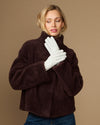 White sheepskin leather gloves with fleece lining, pair covering model's hands