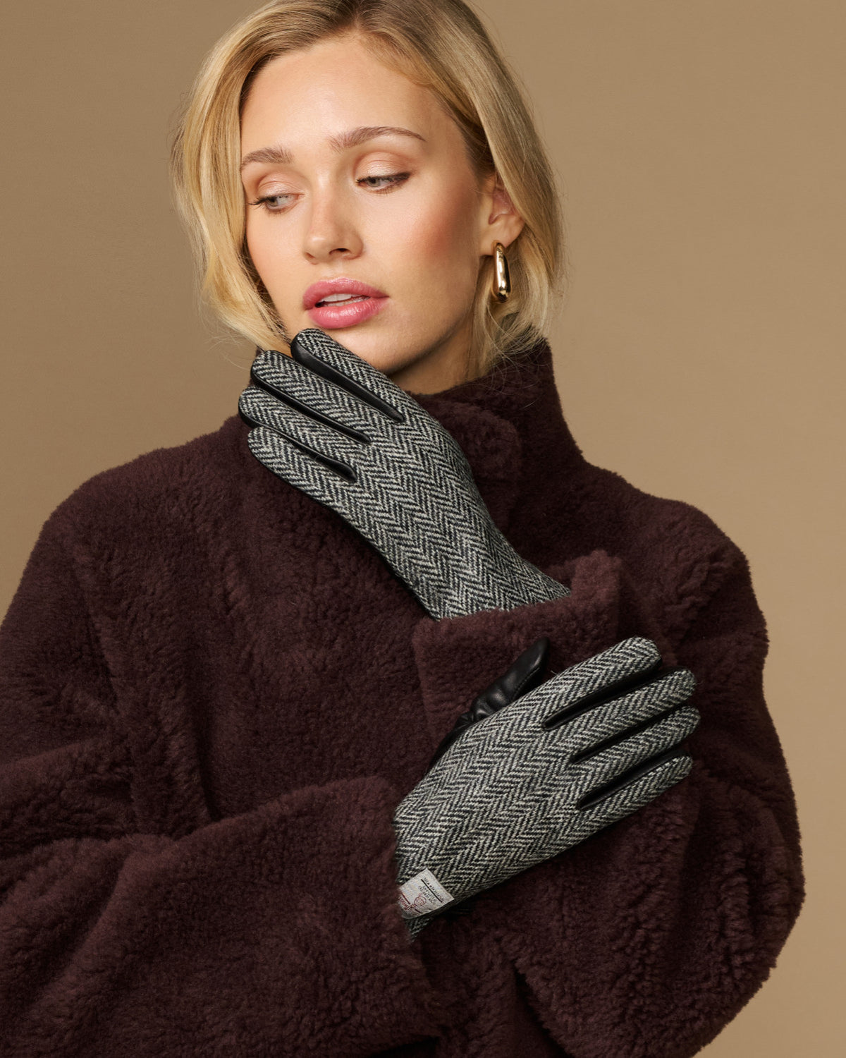 Women's herringbone tweed gloves with black fingertips and dark cuff