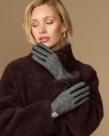Women's herringbone tweed gloves with black fingertips and dark cuff
