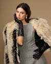 Black leather below-elbow glove with ruched cuff and touchscreen fingertips, glossy