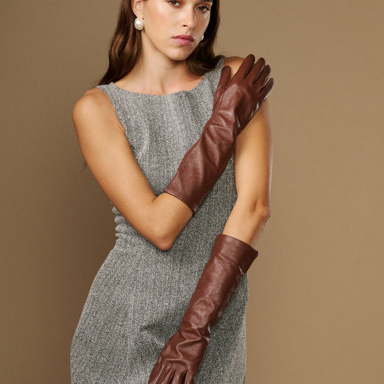 Women's brown below-elbow leather gloves with silk lining, stitched finger seams