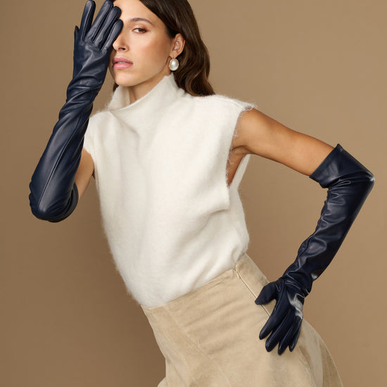Navy lambskin leather opera gloves with long cuffs and silk lining, worn with gloves raised
