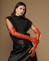 Orange leather gloves with smooth finish; touchscreen feature on finger area