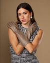 Taupe lambskin leather gloves, below-elbow fit, tapered fingers and slim cuff detail.