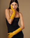 Yellow leather below-elbow gloves with tapered fingers and stitched long cuff edge
