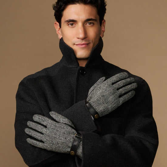 Men's classic gloves in dark felt with gray herringbone panels and black leather wrist.