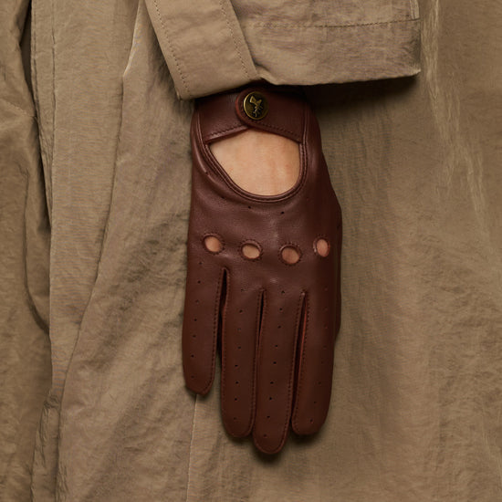 Brown leather gloves featuring an open palm panel and perforated finger rows